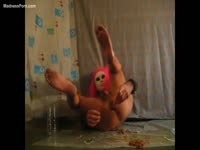 Skinny twink in a freaky clown mask exposing himself and banging his asshole good with a toy